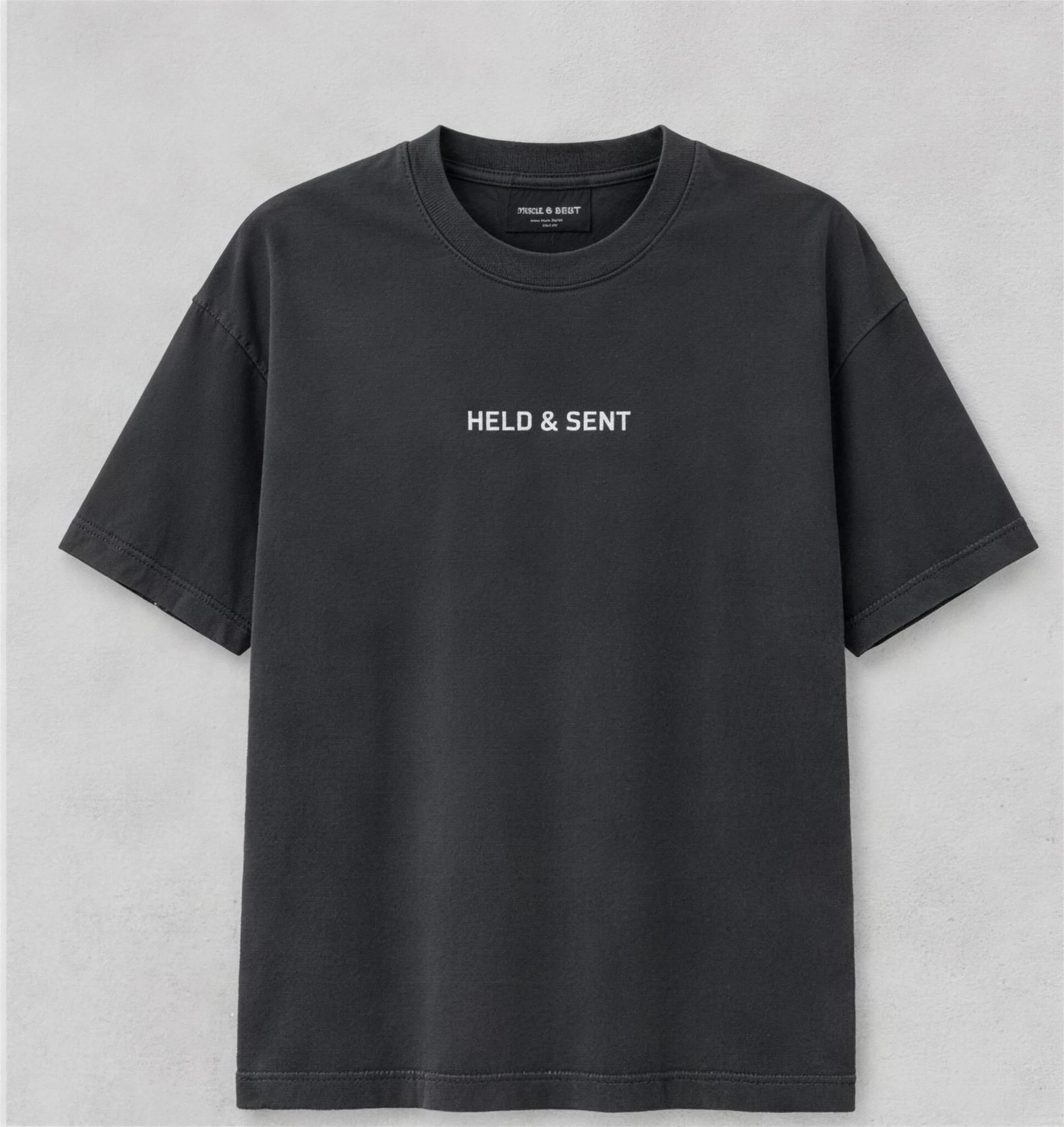 Front of the tee: the wordmark, small and centred